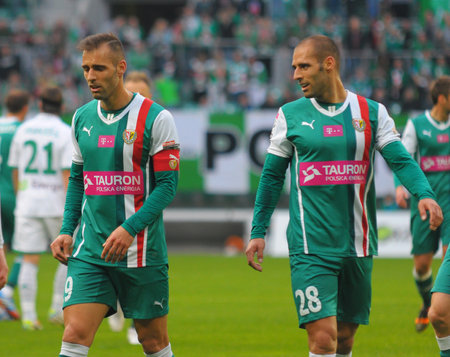 Wroclaw. POLAND - April 12: Match T-Mobile Ekstraklasa between Wks Slask Wroclaw and Lechia Gdansk. Football twins, Flavio and Marco Paxaio on April12, 2014 in Wroclaw. Poland.のeditorial素材