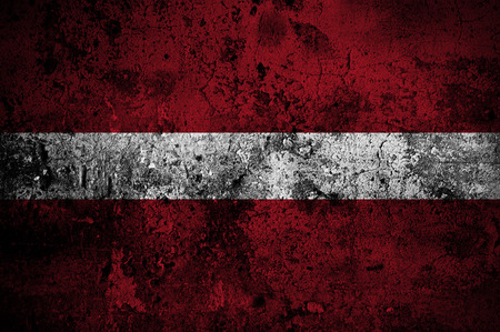 grunge flag of Latvia with capital in Rigaの写真素材