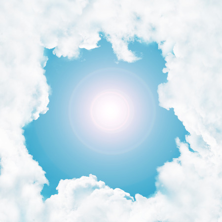 Frame - white clouds in the blue sky and sunの写真素材