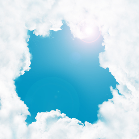 Frame - white clouds in the blue sky and sunの写真素材