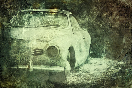 Old Car rusting in forest, damage color vintage photo effectの写真素材