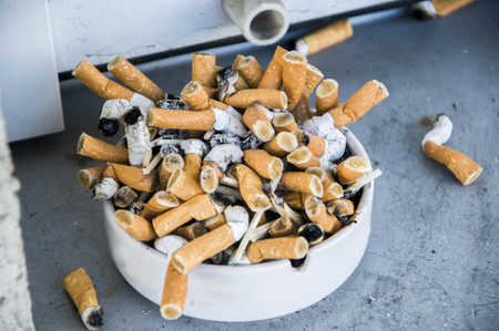 Bad addiction. Ashtray and cigarettes close-upの写真素材