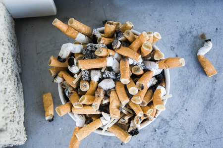 Bad addiction. Ashtray and cigarettes close-upの写真素材