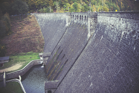 old stone dam wall, vintage effectの写真素材