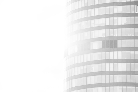 Modern glass silhouettes of skyscrapers in the city with white gradientの写真素材