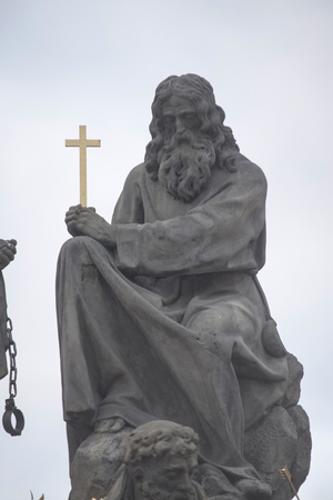 Statue on Charles Bridge (Karluv most, 1357), a famous bridge that crosses Vltava River in Prague, Czech Republicの写真素材