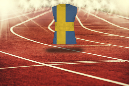 red running track with lines and Sweden flag on shirtの写真素材