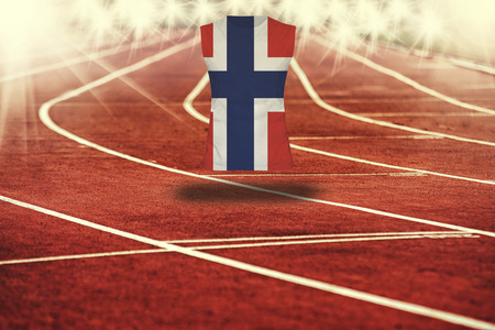 red running track with lines and Norway flag on shirtの写真素材