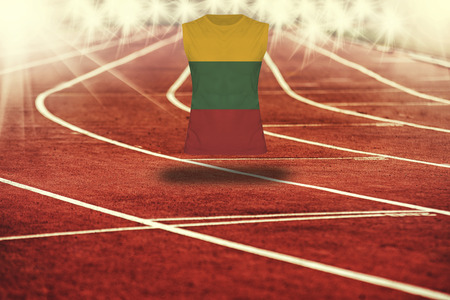 red running track with lines and Lithuania flag on shirtの写真素材