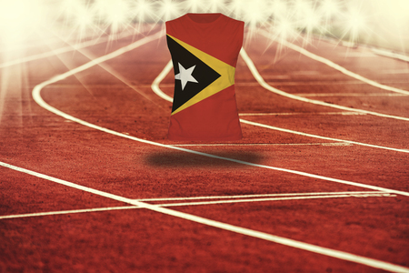 red running track with lines and Timor-Leste flag on shirtの写真素材