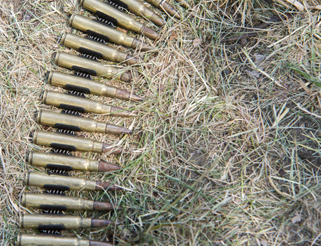 ammo to machine guns on grassの写真素材