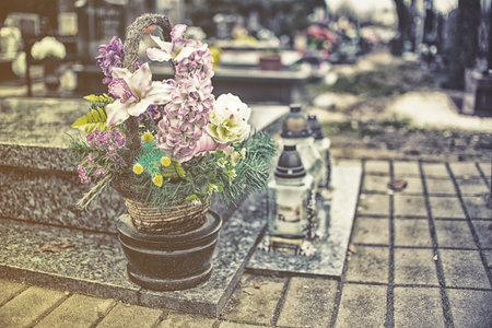 flovers on tombstone in all saints day, vintage effect