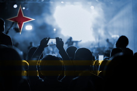 live music concert with blending Aruba flag on fansの写真素材