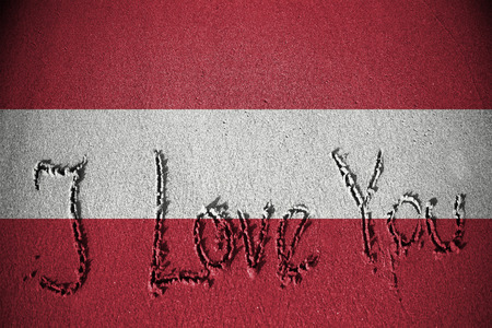 I love you written on sand with blending  Austria flagの写真素材
