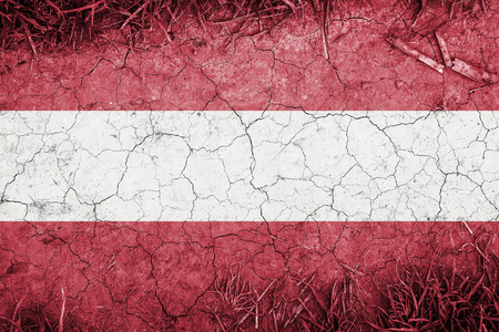 Cracked earth backround with blending  Austria flagの写真素材