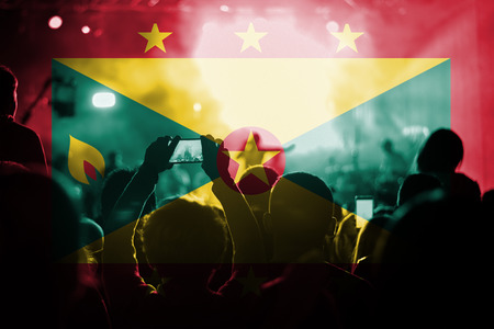 live music concert with blending Grenada flag on fansの写真素材