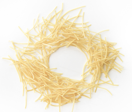 Small dry pasta noodles on white backgroundの写真素材