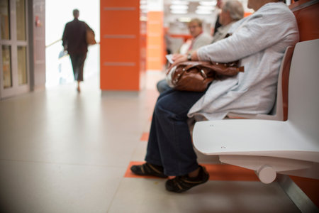 close up on Chairs for patient and visitor in hospital, defocused peopleの写真素材