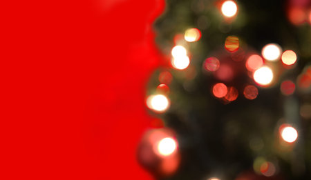 Abstract christmas tree light bokeh on red background