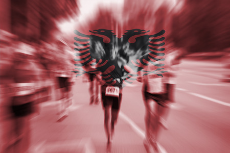 Marathon runner motion blur with blending  Albania flagの写真素材