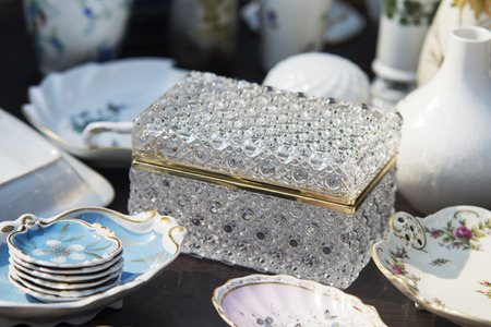 luxory chest and porelain plates on tableの写真素材