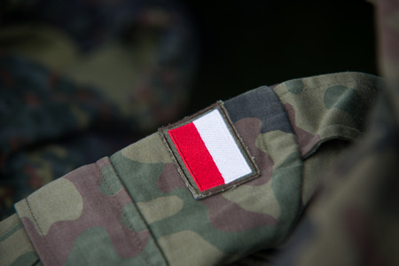 Close up on Polish flag on military uniformの写真素材