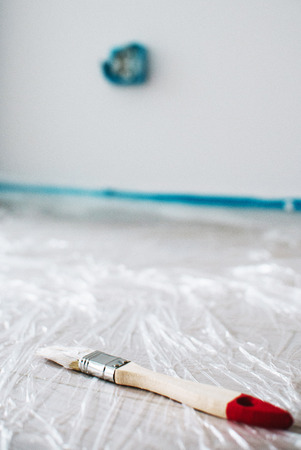 close up on brush with white pain, home repair, wall paintingの写真素材