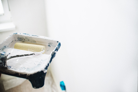 close up on brush with white pain, home repair, wall paintingの写真素材