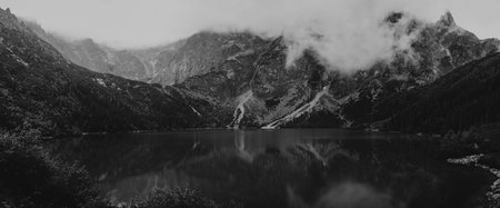 heavy clouds on the sharp Tatra mountain, black and white with noise, Morskie Oko, Zakopane, Poland