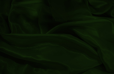 close up on dark green silk material background or textureの写真素材