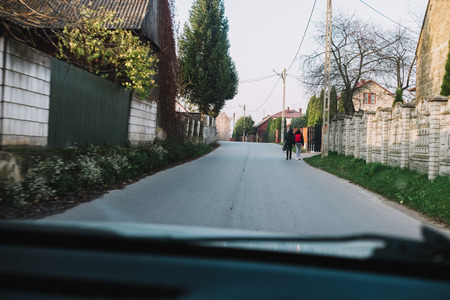two little girls on the street, returning from the schoolの写真素材