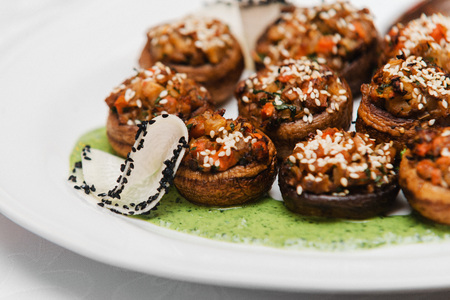 vegan gluten-free champignon with fiery vegetable and nuts, spinach emulsionの写真素材