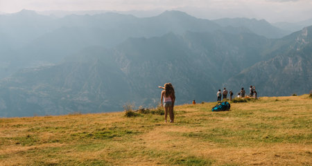 panoramic view from Monte Baldo in Italy with people in backgroundのeditorial素材