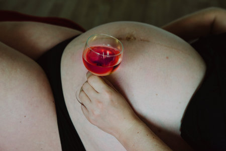 pregnant woman drinks alcohol - wineの写真素材