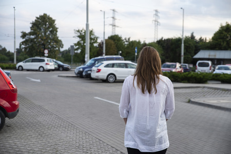 pregnant woman in the parking lotの写真素材