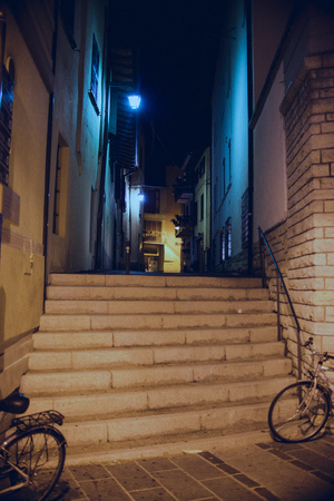 traditional Italian street at nightの写真素材