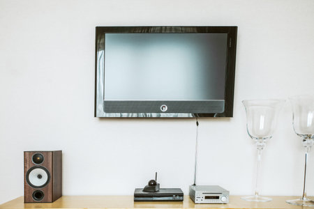 tv on the wall with speakers