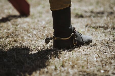 close up on cowboys boot on the grassの写真素材