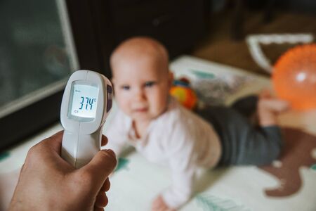 temperature measurement in a child, illness, 37.4の写真素材