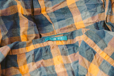 slim fit tag on t-shirt fabric materialの写真素材