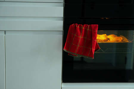 the chicken in the oven is fried, the chicken legsの写真素材