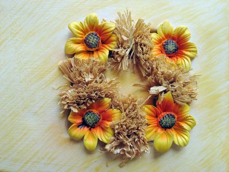 Ornament from ceramic flowers and straw の写真素材
