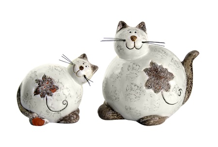 Two clay thick cat's figures on a white backgroundの写真素材