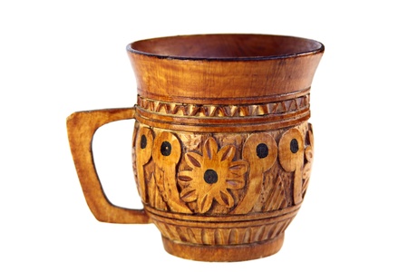 decorative carved wooden mug on a white backgroundの写真素材