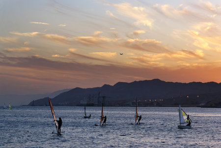 Windsurfing on the Red Sea against the sunset