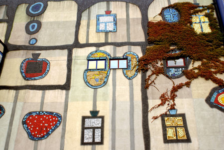 VIENNA, AUSTRIA  -  SEPTEMBER 23, 2007: The windows and mosaics on the wall of the incinerator Shpitelau in Vienna. The architect Hundertwasserのeditorial素材