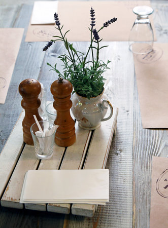 KIBBUTZ SNIR, ISRAEL -  MAY 27, 2015: Table setting in a rustic style with a bouquet of lavenderのeditorial素材