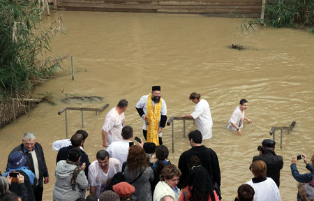 JORDAN RIVER, ISRAEL - DECEMBER 14, 2014: The baptism in the Jordan River for the Orthodox traditionのeditorial素材