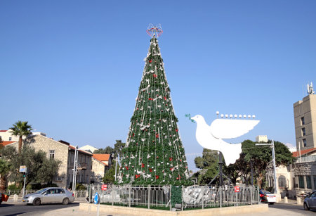 HAIFA, ISRAEL - DECEMBER 22, 2015: Christmas tree and the figure of a dove of peace in Haifaのeditorial素材