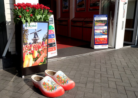 AMSTERDAM, NETHERLANDS - MAY 13, 2017: National wooden shoes are in front of the entrance to the tourist officeのeditorial素材